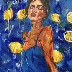 A portrait of a beautiful girl surrounded by lemons.